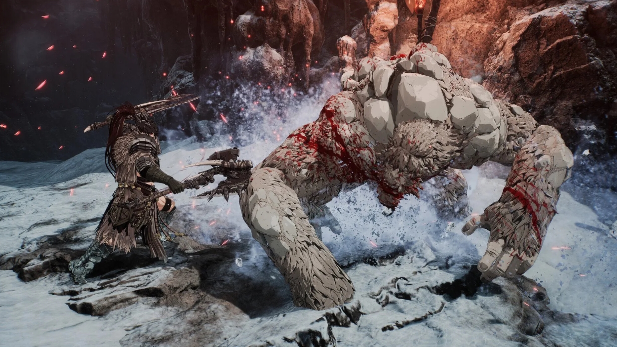 Fierce battle against a massive stone creature in a snowy canyon in The First Berserker Khazan