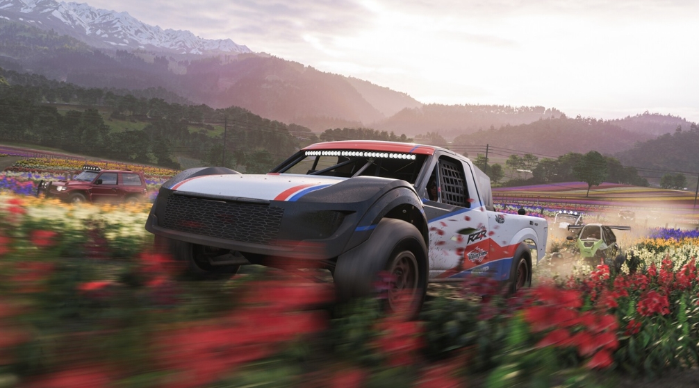 off-road racing through colorful flower fields in the open world of Forza Horizon 6