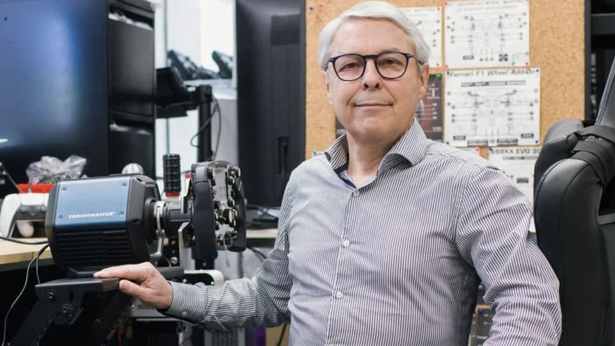 Claude Guillemot standing beside Thrustmaster gaming hardware owned by Guillemot Corporation