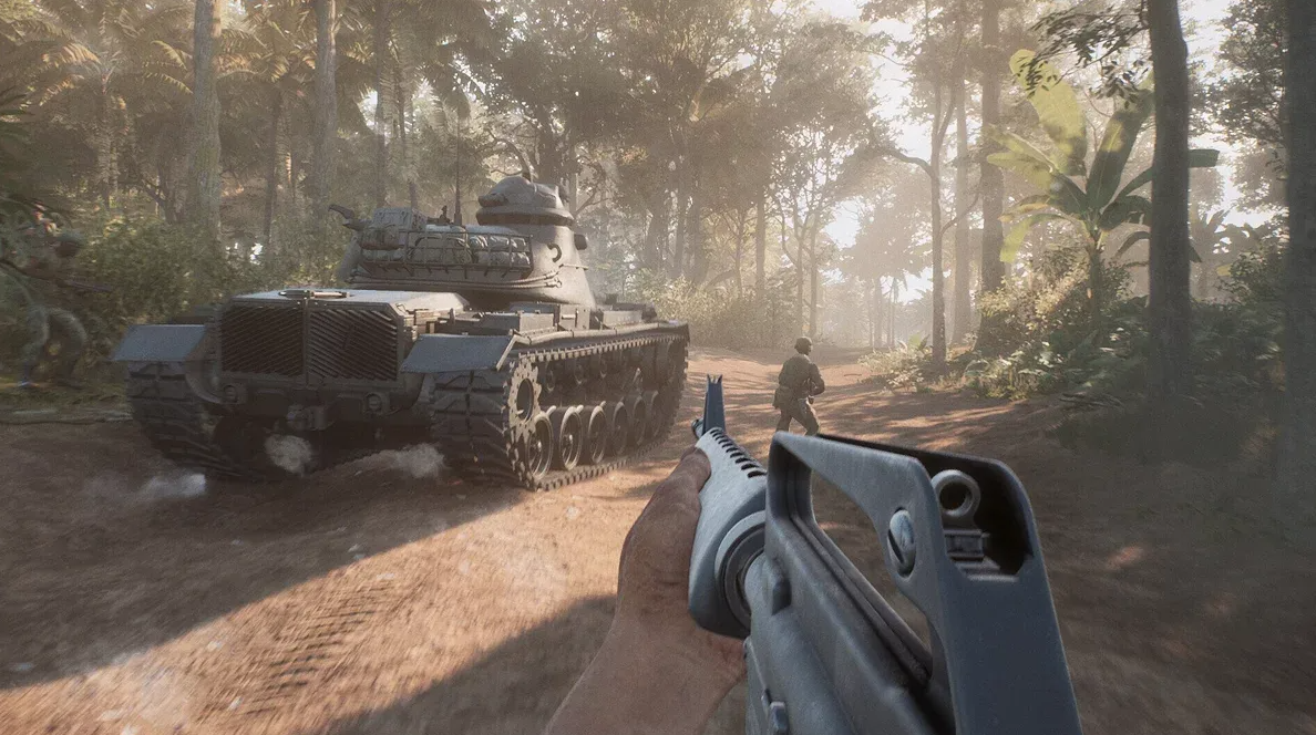 First-person view of a soldier with a rifle near a tank in the jungle — Hell Let Loose: Vietnam gameplay, illustrating article on the game's first hotfix